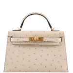 Hermès Dupe Mini Kelly 20 II Parchemin Ostrich GHW - Exotic Creations